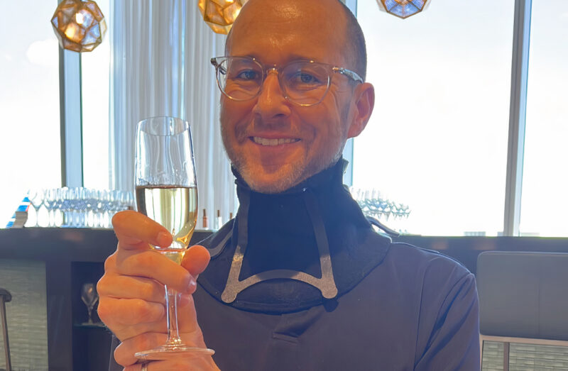 Albert holding wine glass
